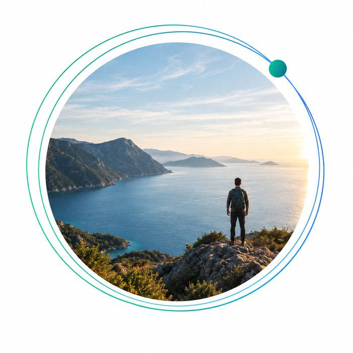 A person standing on a rocky overlook, facing the sea and distant mountains inside the circular glocal360 frame.